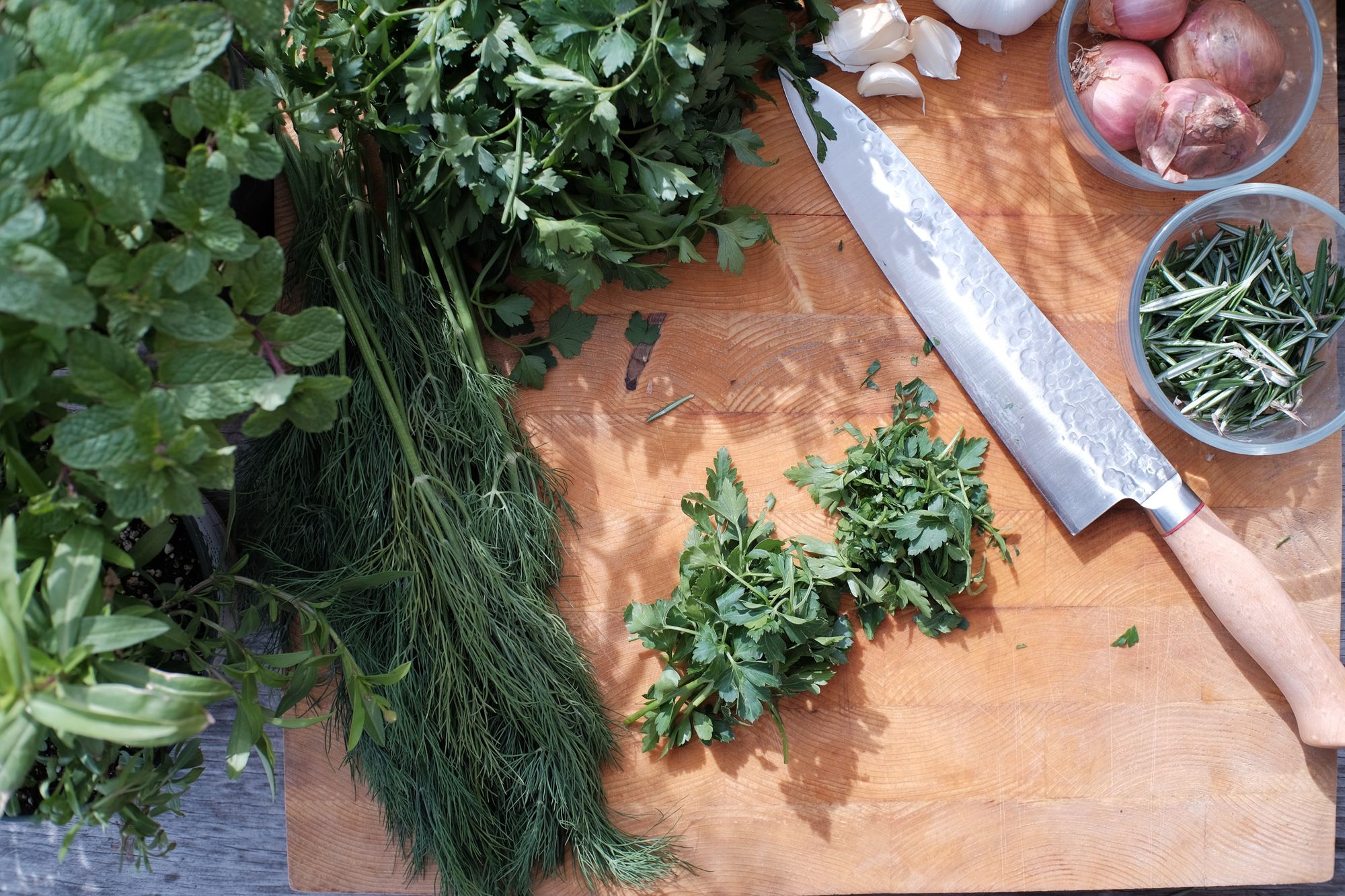 adding herbs to dishes